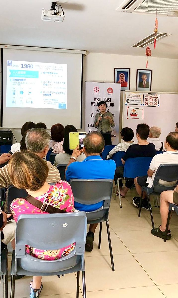 Jessica Koh speaking at West Coast Wellness Club, educating seniors on financial planning